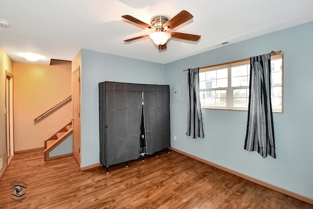 unfurnished bedroom with hardwood / wood-style flooring and ceiling fan