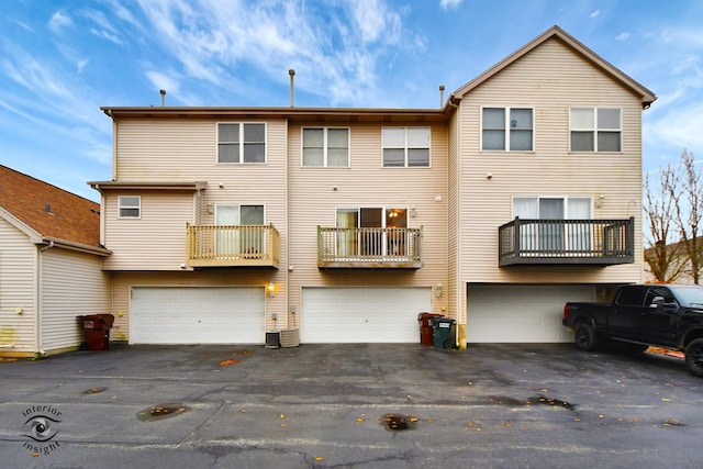 back of house featuring a garage