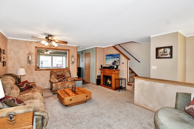 living room with light colored carpet, ceiling fan, and crown molding