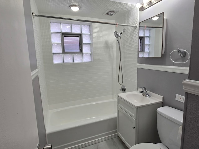 full bathroom featuring wood-type flooring, vanity, toilet, and tiled shower / bath