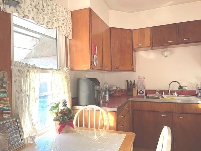 kitchen with tile counters and sink