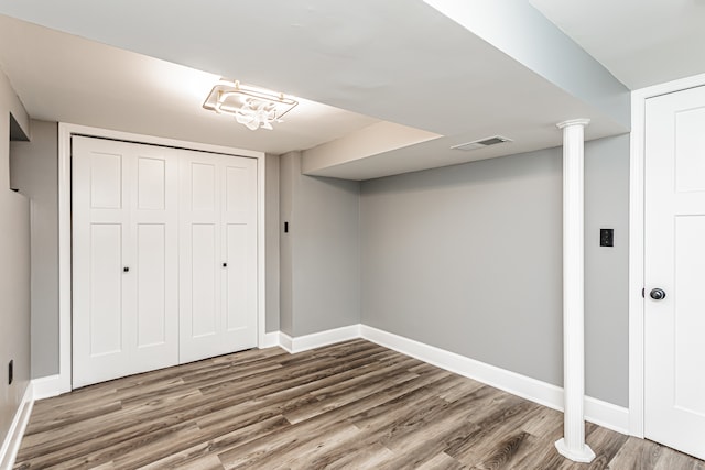 basement featuring wood-type flooring