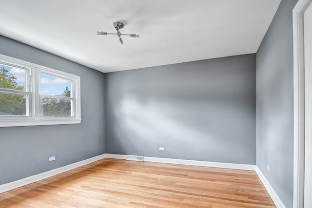 empty room with wood-type flooring