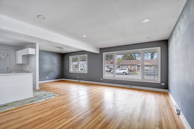 unfurnished living room featuring light hardwood / wood-style flooring