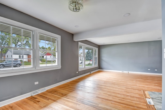 spare room featuring light hardwood / wood-style flooring