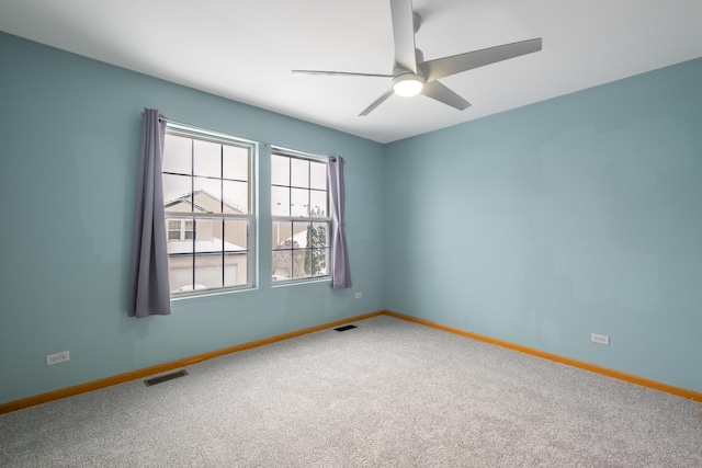 unfurnished room with carpet flooring and ceiling fan