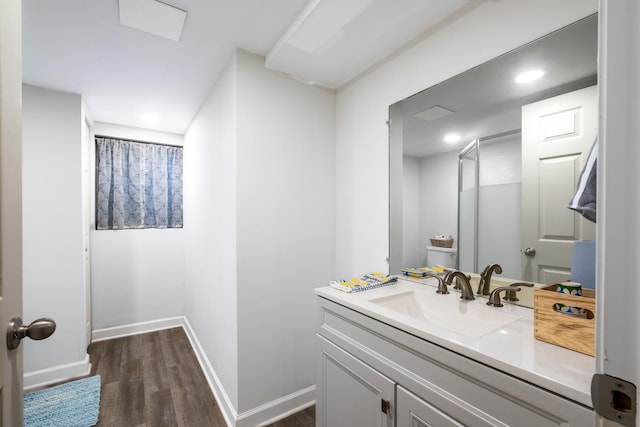 bathroom featuring hardwood / wood-style floors and vanity