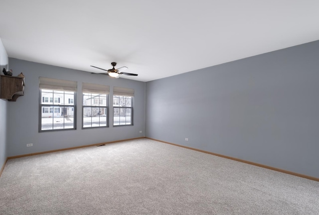 empty room with carpet floors and ceiling fan