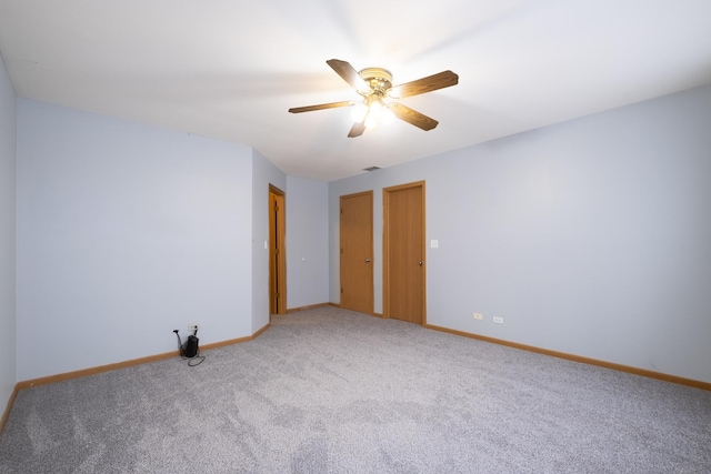 spare room featuring carpet flooring and ceiling fan