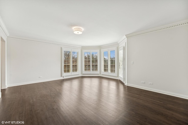 empty room featuring dark hardwood / wood-style flooring and crown molding