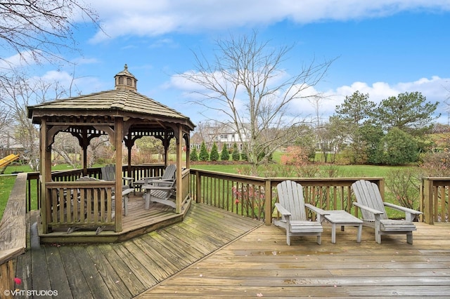 wooden terrace featuring a gazebo