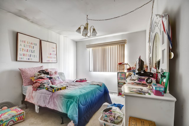 carpeted bedroom with an inviting chandelier