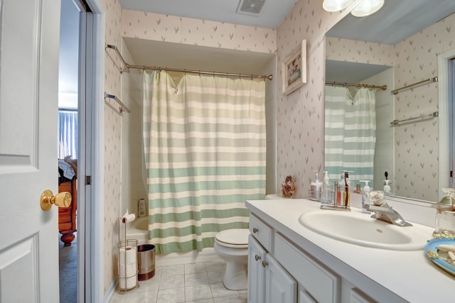 bathroom featuring walk in shower, tile patterned flooring, vanity, and toilet