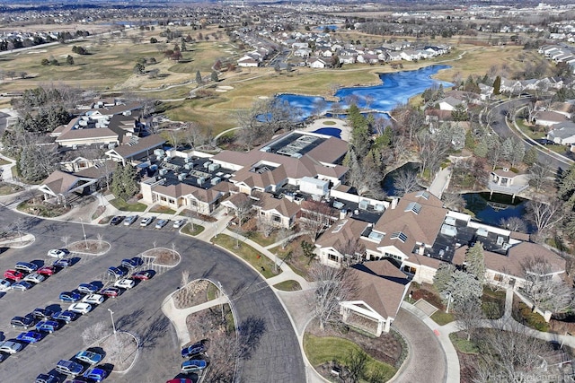 birds eye view of property with a residential view and a water view