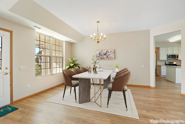 dining space featuring an inviting chandelier, baseboards, visible vents, and light wood-type flooring