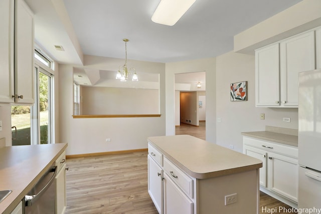 kitchen featuring dishwasher, white cabinets, light wood-type flooring, and freestanding refrigerator