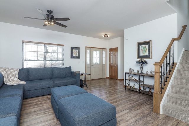 living room featuring ceiling fan and wood-type flooring