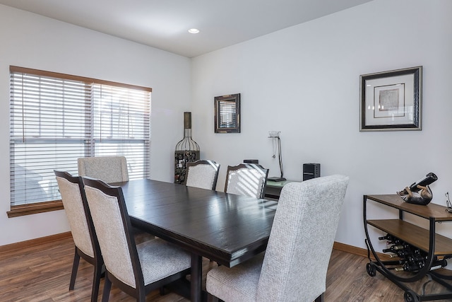 dining room with dark hardwood / wood-style floors