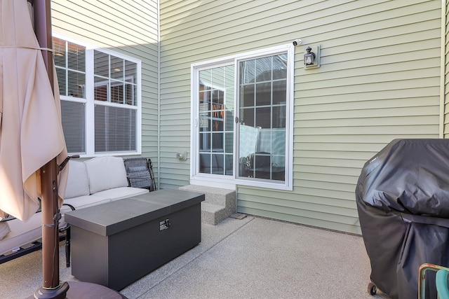 view of patio / terrace with an outdoor living space and a grill