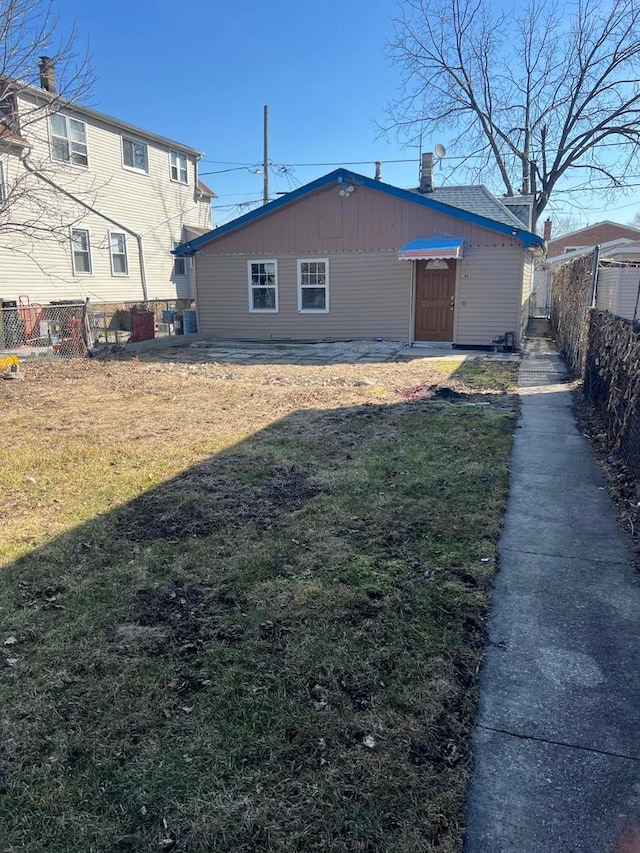 exterior space with a yard and fence