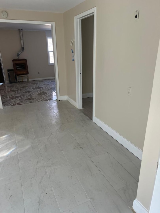 empty room featuring baseboards