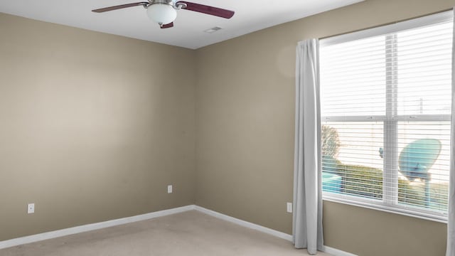 unfurnished room with light carpet and ceiling fan