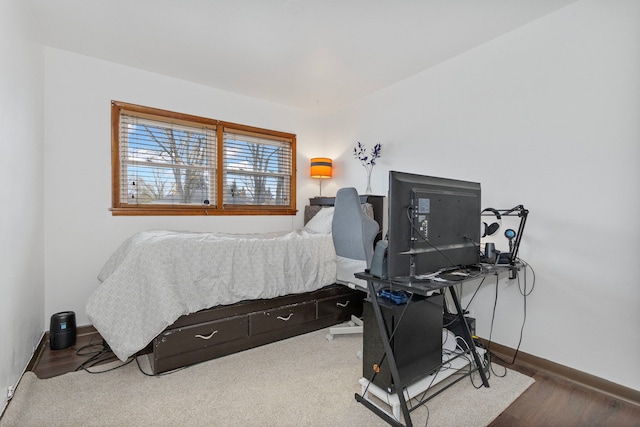 bedroom with hardwood / wood-style floors