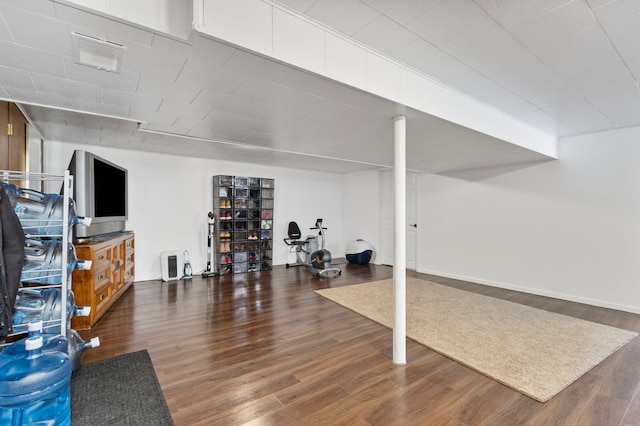 exercise room featuring dark wood-type flooring