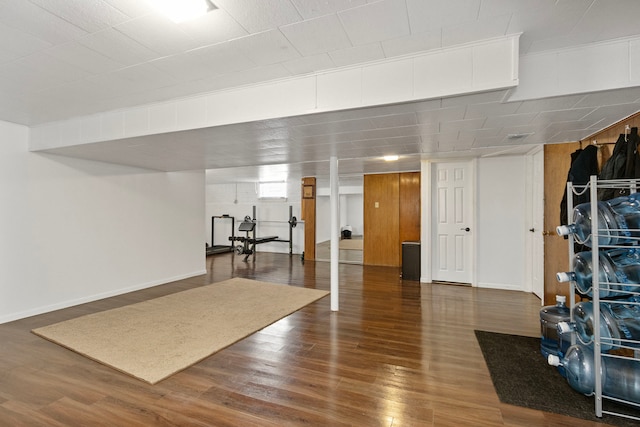 basement featuring dark wood-type flooring