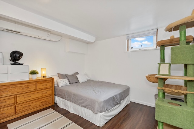 bedroom featuring dark hardwood / wood-style floors