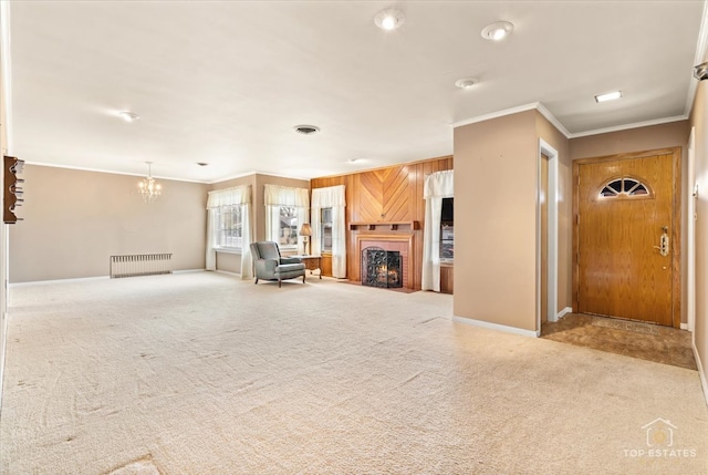 unfurnished living room with light carpet, radiator heating unit, and crown molding