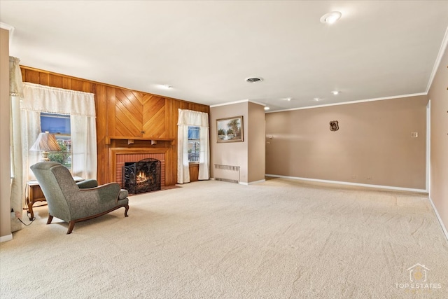 living area featuring crown molding, light colored carpet, a fireplace, and radiator