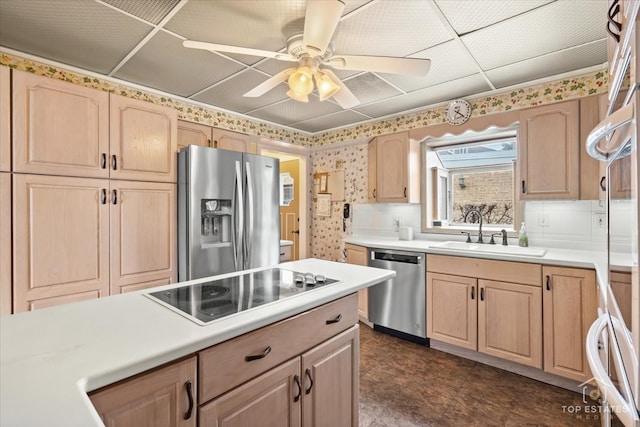 kitchen with ceiling fan, light brown cabinets, sink, and stainless steel appliances