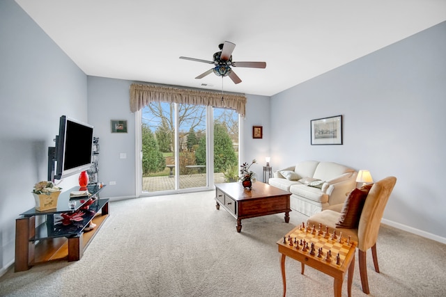 living room with carpet floors and ceiling fan