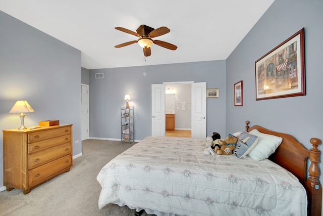 bedroom featuring ceiling fan, carpet floors, and ensuite bathroom