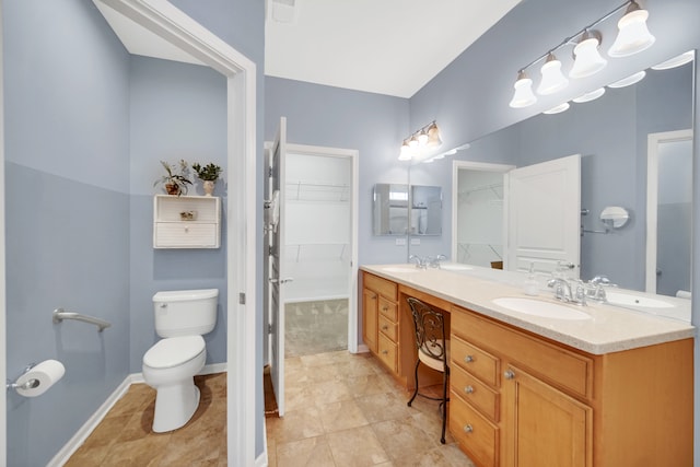 bathroom featuring tile patterned floors, vanity, and toilet