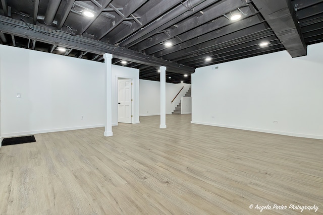 basement featuring light hardwood / wood-style floors