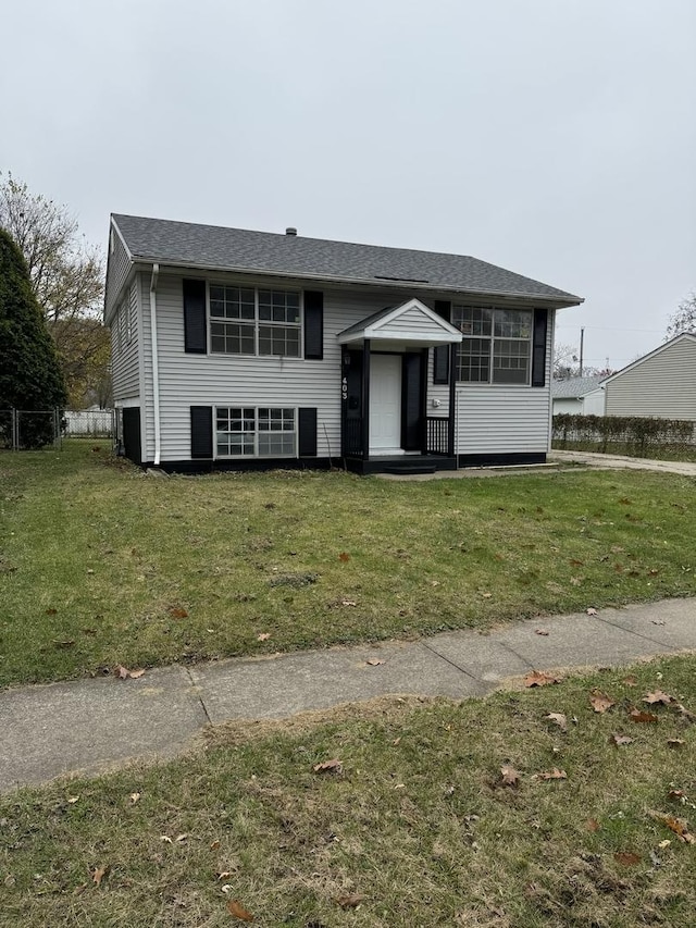 bi-level home with a front yard