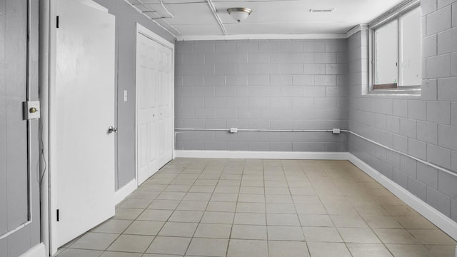 empty room with light tile patterned flooring