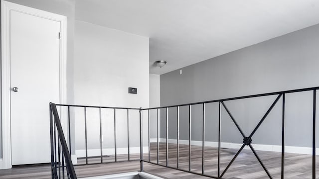 stairs with wood-type flooring