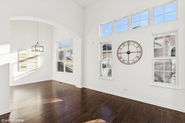 empty room featuring wood-type flooring