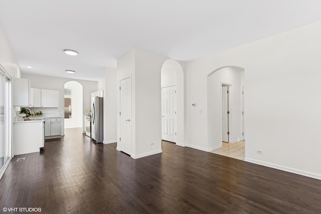 unfurnished living room featuring wood-type flooring