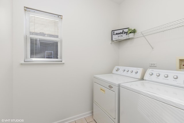 washroom featuring washer and dryer and light tile patterned floors