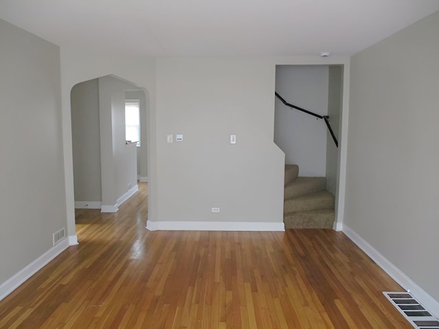 empty room featuring hardwood / wood-style flooring