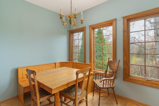 dining area featuring a chandelier and light wood-type flooring