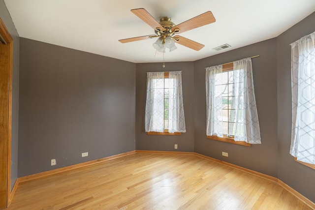 empty room featuring ceiling fan and light wood-type flooring