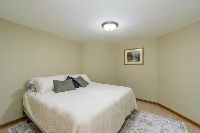 bedroom with light tile patterned floors