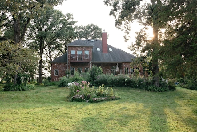 rear view of house with a lawn