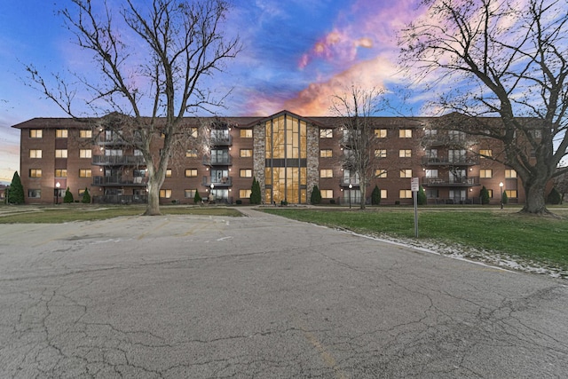 view of outdoor building at dusk