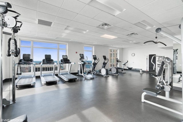 workout area featuring a drop ceiling